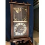 A 20th century mahogany president 31 day wall clock