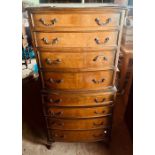 A 20th Century mahogany chest on chest, in a Queen Anne style, bow front shape moulded shape top,