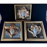 Nigel John Wilde three relief moulded and gold lustre studio pottery portrait plaques fabric mounted