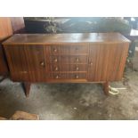 A mid 20th century teak sideboard; a similar trio nest of tables (2)