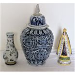 A Dutch Delft blue and white octagonal vase and cover painted with stylised foliate scrolls, 19th