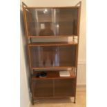 A Mid Century Ladderax  three glazed unit modular cabinet  Very good condition complete and