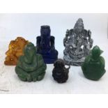 A collection of four carved stone figure of Ganesh together with a ring. (6)