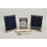 A wooden cased silver mounted quartz clock, having rectangular dial signed R.Carr Clockmaker,