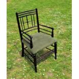 A West Sussex ebonised chair. Condition note: re-upholstered, originally rush seated, no signs of