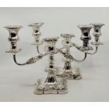 A pair of silver three light, two branch candelabra, by Viner's Ltd, Sheffield, 1957, having