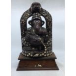 An Indian carved wooden figure of Ganesh. H:38cm