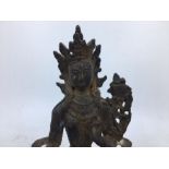 An East Asian bronze figure of a deity. H:18.4cm