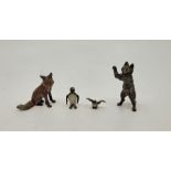 Four Austrian cold painted bronze figures, to include: a small owl, height 1.3cm, small penguin,