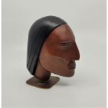 A Hagenauer carved hardwood bust of a Native American Brave, raised upon brass base stamped "