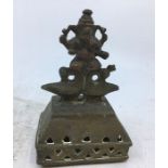 An Indian bronze figure of a deity. H:10.2cm