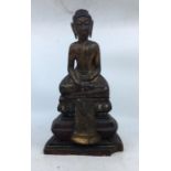 An Asian carved wooden figure of Buddha. H:39cm