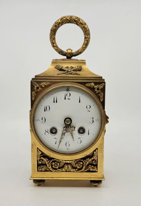 A late 19th century French ormolu officer's clock, bell strike, having white enamel Arabic numeral