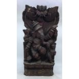 An Indian carved wooden figure of a deity. H:45cm
