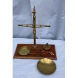 A set of brass oversized scales and a large collection of copperware