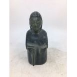 A carved stone figure of a man. H:13.4cm