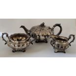 A matched William IV silver three piece tea service, of lobed melon shape, the teapot and twin