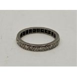 A precious white metal and diamond eternity ring, (white metal assessed as platinum) size UK M 1/