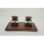 A Victorian brass tortoiseshell mounted ink stand, having twin inkwells with hinged covers, length
