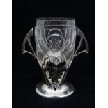 WMF: An Art Nouveau pewter two handled vase with cut glass liner, with grape and vine design and