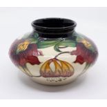 Moorcroft Pottery: An "Annalily" patterned vase, dated 1998, signed to underneath.  Approx. 11.5cm