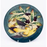 Moorcroft Pottery: A bird decorated 2003 year plate, number 219/750. Marked to underneath.