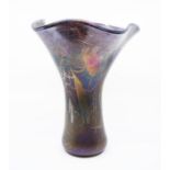 Ditchfield glass - A vase of floral spray form with lustred purple, green colourway. Signed to