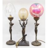 Three early to mid 20th Century Art Deco table lamps with lady figure detail, glass shades