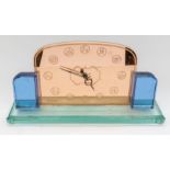 A large Art Deco glass style mantle clock with star sign numerals