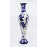 Moorcroft Pottery: An "Australian Orchid" patterned 2012 Kerry Goodwin designed vase, decorated in