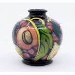 Moorcroft Pottery: A "Queens Choice" patterned vase, dated 2000 and signed underneath. In box.