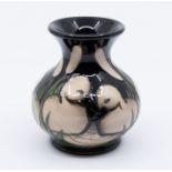 Moorcroft Pottery: A "Cygnets" patterned small vase, in box, dated 2012 and signed to underneath.