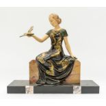 Art Deco spelter figure of a lady holding a dove on marble stand