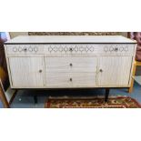 A Berry Furniture melamine sideboard, with a stylised design on ebonised and chrome legs, retailed