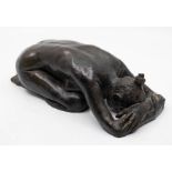 A 20th century contemporary bronze model of a laying nude lady with head in hands. Signed PW?? (