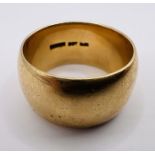 A substantial yellow metal ring, stamped "9ct". Gross weight approximately 15.8 grams. Size U.