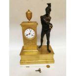 A mid 19th century bronze and ormolu French Empire mantel clock with the figure of Patrocle stood to