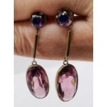 A pair of amethyst and yellow metal ear pendants. Gross weight approximately 6 grams.