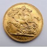 A George V gold sovereign coin, dated 1914.