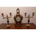 A French Louis Boulle tortoise shell style mantle clock and matching candlestick garniture. 8 day