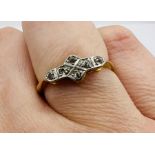 An Art Deco diamond set panel ring, in yellow metal, stamped "18ct + Plt". Approximate weight 2.3