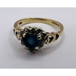 A 9ct gold diamond and London blue topaz heart dress ring. Size K. Gross weight approximately 2.0