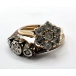 A diamond ring along with a 9ct gold ring. A 9ct gold Cubic Zirconia Flower head cluster ring. Gross