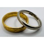 Two gold rings - comprising a white 18ct gold band ring, approximate weight 3.0 grams, size J1/2;