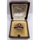 A late 19th century ruby and diamond daisy cluster ring, stamped 18ct. Approximate weight 3.3 grams,