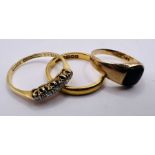 A selection of three rings. Comprising an 18ct stamped diamond half hoop ring (approximate weight