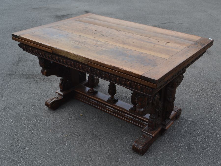 A walnut drawer leaf table, early 17th Century and later, rectangular three planked later oak top