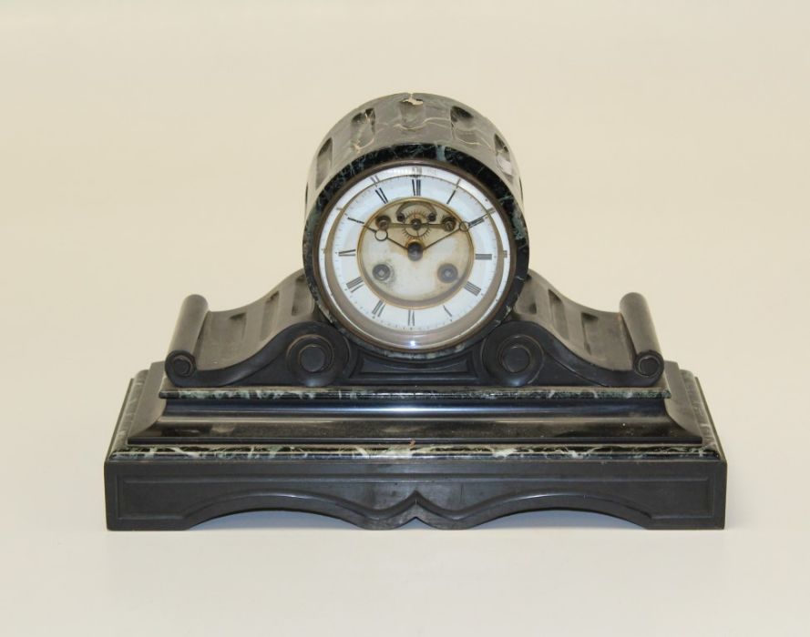 A late 19th century French varigated  marble and black slate drum head mantle clock, with eight