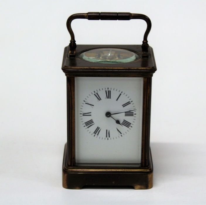 An early 20th brass, five glass carriage clock, the eight day movement faced by enamel Roman dial.