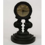 A 19th century bronze mantle timepiece, the organic form case with florally cast dial surround,